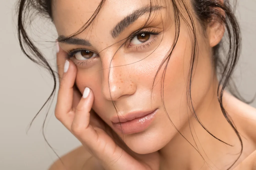 Close-up of woman with glowing skin after chemical peel treatment