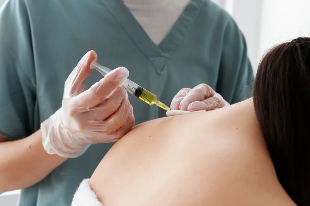 Medical professional preparing glutathione injection for IV therapy at Park City Medesthetix