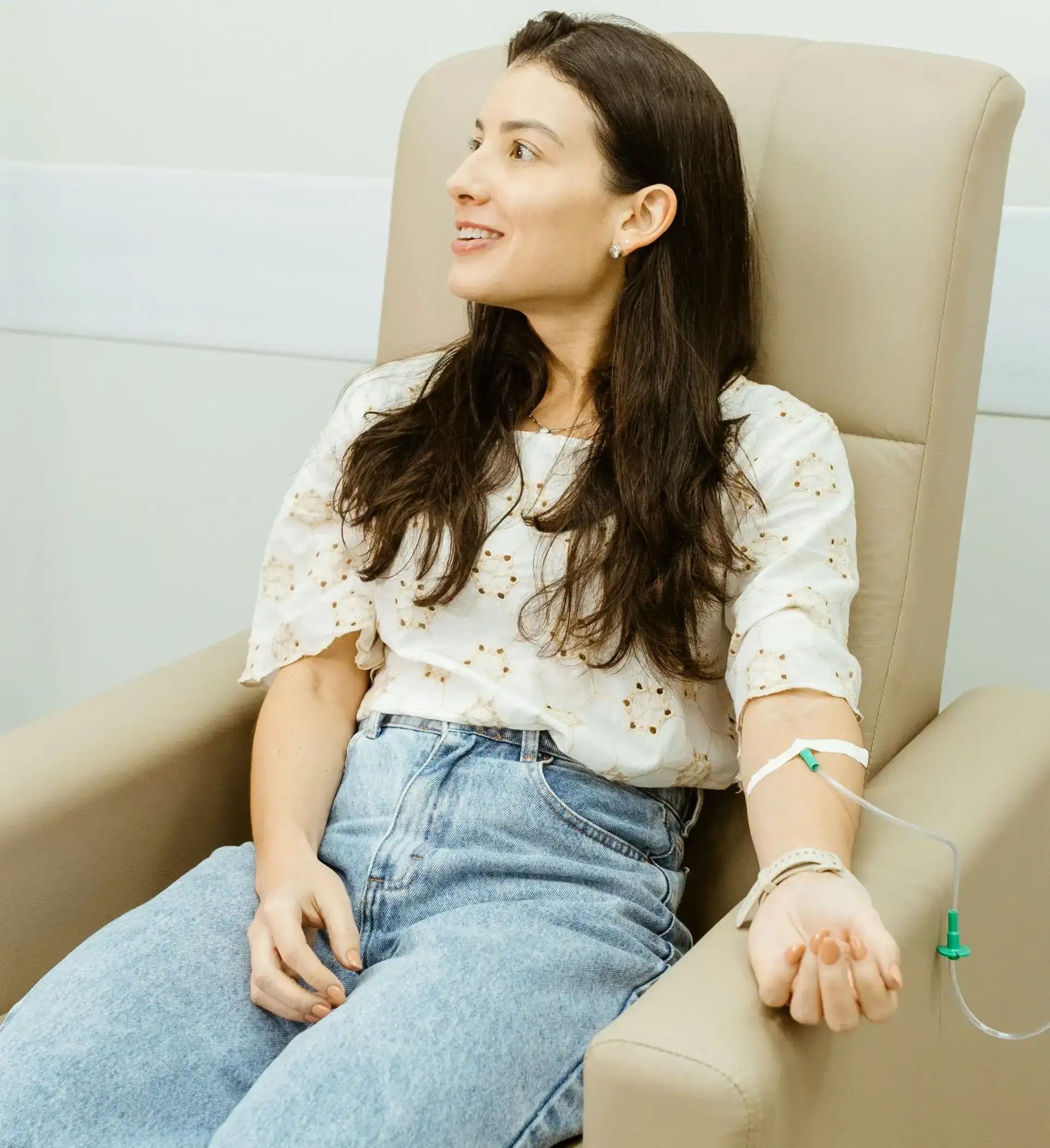 Relaxed woman recovering and feeling energized after NAD+ glutathione therapy session